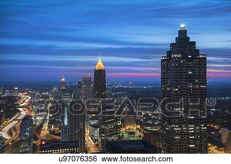 Stock Photograph - USA, Georgia, Atlanta, Cityscape with skyscrapers at dawn. Fotosearch