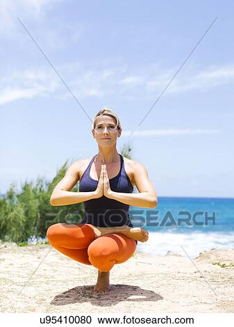 USA, Hawaii, Kauai, Woman doing yoga on sunny day View Large Photo Image Stock Image - USA, Hawaii, Kauai, Woman doing yoga on sunny day. Fotosearch