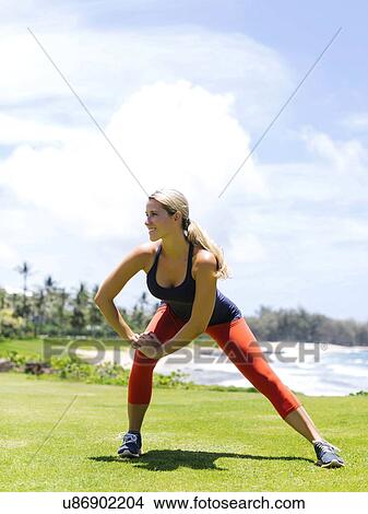 USA, Hawaii, Kauai, Woman exercising on beach View Large Photo Image Picture - USA, Hawaii, Kauai, Woman exercising on beach. Fotosearch