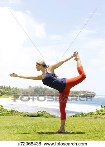 USA, Hawaii, Kauai, Woman stretching on sunny day View Large Photo Image Stock Photo - USA, Hawaii, Kauai, Woman stretching on sunny day. Fotosearch