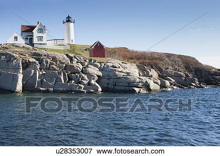 USA, Maine, York, Cape Neddick, Nubble Light lighthouse at seashore View Large Photo Image Stock Photo - USA, Maine, York, Cape Neddick, Nubble Light lighthouse at seashore. Fotosearch