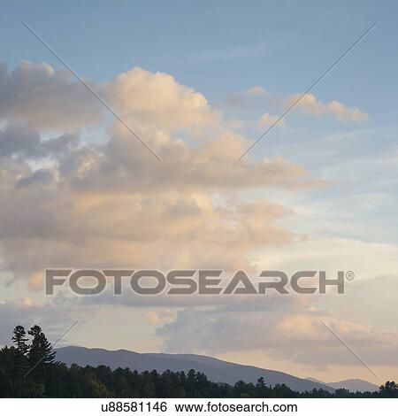 USA, New York, North Elba, Lake Placid, Clouds above mountains at dusk View Large Photo Image Stock Photograph - USA, New York, North Elba, Lake Placid, Clouds above mountains at dusk. Fotosearch