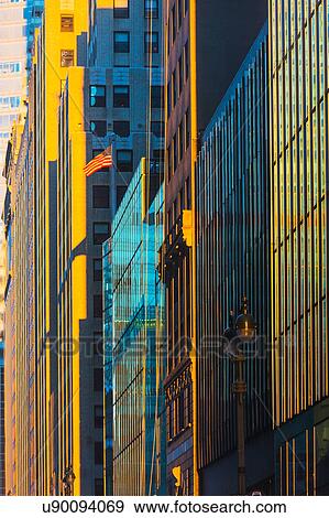 Stock Photo - USA, New York State, New York City, Downtown skyscrapers at sunrise. Fotosearch