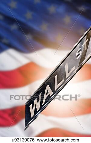 Stock Photograph - USA, New York State, New York City, Wall street sign with American Flag. Fotosearch