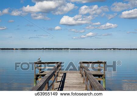 Stock Photo - USA, North Carolina, Pier on sunny day. Fotosearch