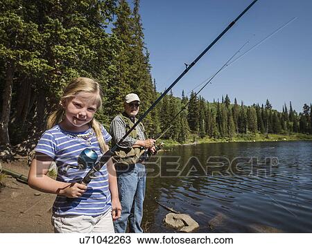 USA, Utah, Lake City, Girl (4-5) with grandfather fishing in lake View Large Photo Image Stock Image - USA, Utah, Lake City, Girl (4-5) with grandfather fishing in lake. Fotosearch