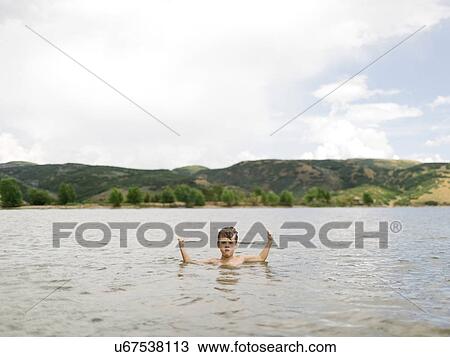 USA, Utah, Park City, Boy (6-7) flexing muscles in lake View Large Photo Image Stock Image - USA, Utah, Park City, Boy (6-7) flexing muscles in lake. Fotosearch