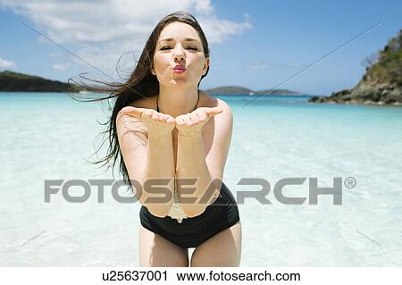 USA, Virgin Islands, Saint Thomas, Beautiful woman blowing kisses on beach View Large Photo Image Stock Image - USA, Virgin Islands, Saint Thomas, Beautiful woman blowing kisses on beach. Fotosearch