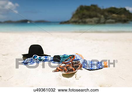 Stock Image - USA, Virgin Islands, Saint Thomas, Clothes left on beach. Fotosearch