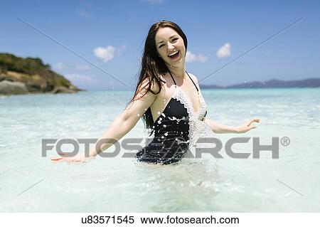 Stock Photography - USA, Virgin Islands, Saint Thomas, Beautiful woman having fun on summer vacations. Fotosearch