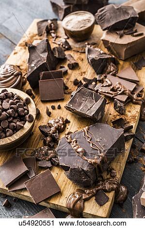 Various chocolate pieces on cutting board View Large Photo Image Stock Image - Various chocolate pieces on cutting board. Fotosearch