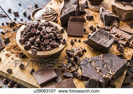 Stock Photo - Various chocolate pieces on cutting board. Fotosearch