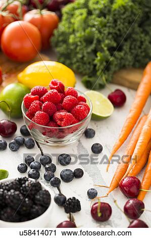 Stock Image - Various fresh fruits and vegetables. Fotosearch