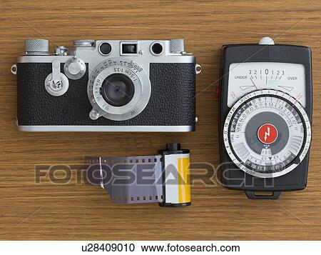Vintage camera with film View Large Photo Image Stock Image - Vintage camera with film. Fotosearch