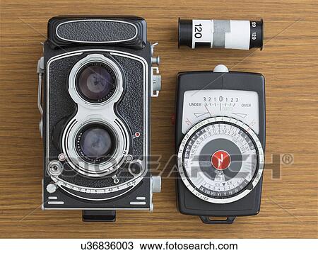 Vintage camera with film View Large Photo Image Stock Image - Vintage camera with film. Fotosearch