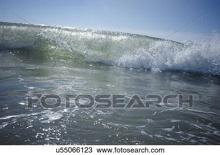 Stock Image - Waves on sunny day. Fotosearch