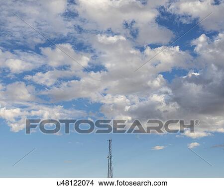 White clouds over communications tower View Large Photo Image Picture - White clouds over communications tower. Fotosearch