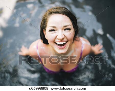 Stock Photo - Woman bathing in mud. Fotosearch