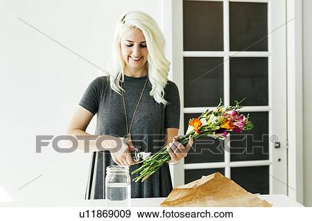 Stock Photo - Woman cutting bouquet. Fotosearch