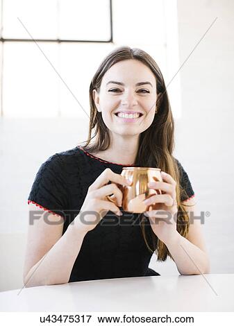 Stock Photo - Woman drinking hot chocolate. Fotosearch