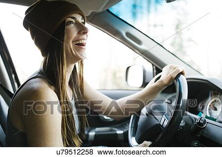 Woman driving car View Large Photo Image Stock Photo - Woman driving car. Fotosearch