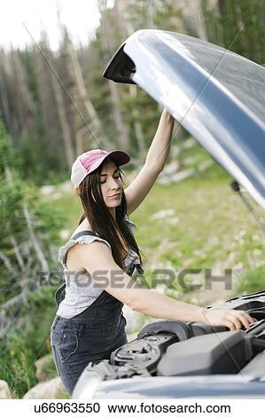 Woman experiencing car problems during trip View Large Photo Image Stock Image - Woman experiencing car problems during trip. Fotosearch