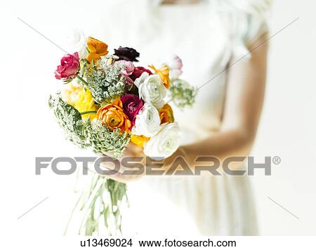 Picture - Woman holding bouquet. Fotosearch