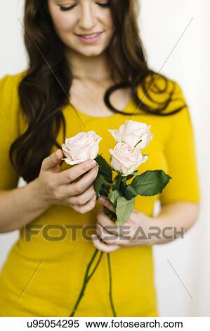 Stock Photography - Woman holding roses. Fotosearch