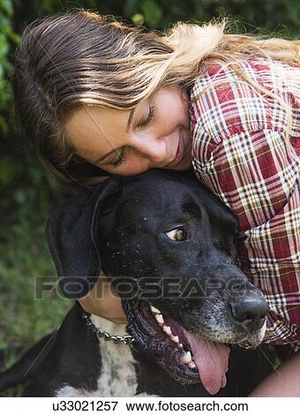 Woman hugging Great Dane View Large Photo Image Stock Photo - Woman hugging Great Dane. Fotosearch
