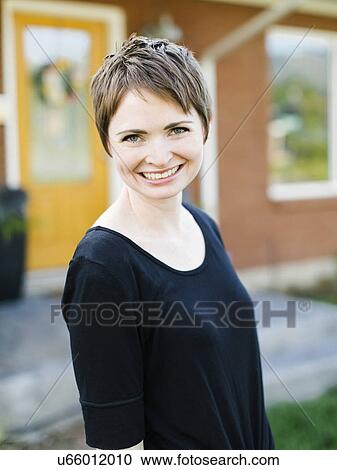 Woman looking at camera View Large Photo Image Stock Image - Woman looking at camera. Fotosearch
