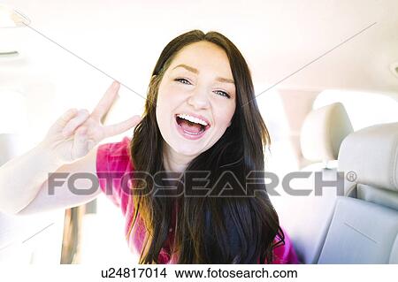Woman making peace gesture View Large Photo Image Picture - Woman making peace gesture. Fotosearch