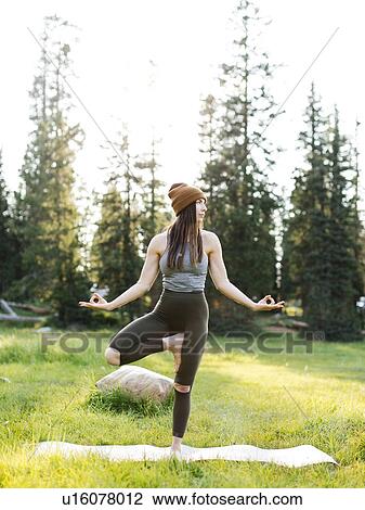 Woman practicing yoga in forest View Large Photo Image Stock Image - Woman practicing yoga in forest. Fotosearch
