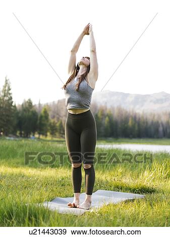 Woman practicing yoga in forest View Large Photo Image Stock Photo - Woman practicing yoga in forest. Fotosearch