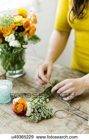 Stock Photo - Woman preparing bouquet. Fotosearch