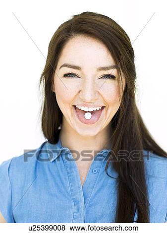 Woman showing mint on tongue View Large Photo Image Stock Photo - Woman showing mint on tongue. Fotosearch