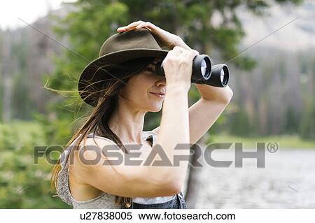 Woman using binoculars View Large Photo Image Stock Photography - Woman using binoculars. Fotosearch