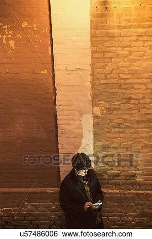 Woman using smart phone View Large Photo Image Stock Photograph - Woman using smart phone. Fotosearch