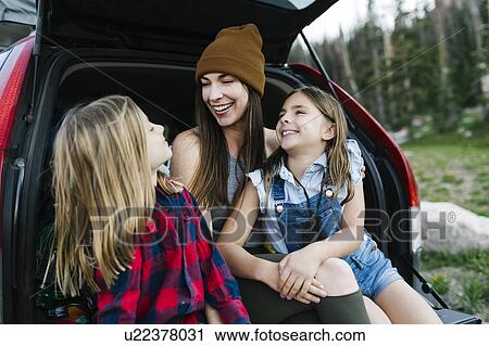 Woman with son (6-7) and daughter (8-9) in back of car View Large Photo Image Stock Image - Woman with son (6-7) and daughter (8-9) in back of car. Fotosearch