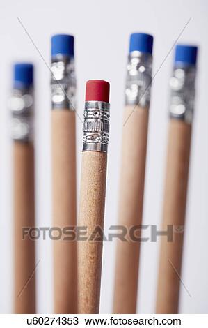 Stock Image - Wooden pencils, one with red eraser. Fotosearch