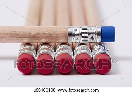 Stock Photo - Wooden pencils with red erasers, one with blue on top. Fotosearch