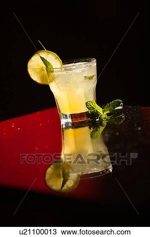 Yellow cocktail with mint leaf View Large Photo Image Stock Image - Yellow cocktail with mint leaf. Fotosearch