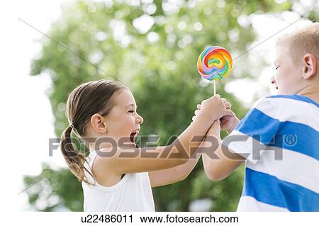 Young boy (6-7) teasing sister (4-5) View Large Photo Image Stock Image - Young boy (6-7) teasing sister (4-5). Fotosearch