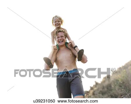 Young man carrying brother on shoulders View Large Photo Image Stock Image - Young man carrying brother on shoulders. Fotosearch
