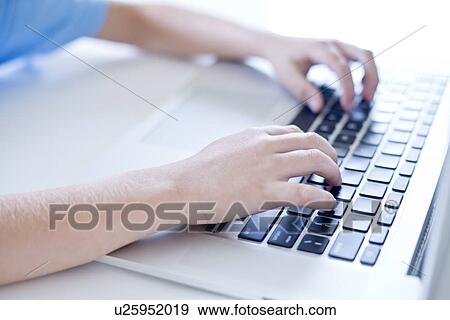 Boy using laptop keyboard, close up. View Large Photo Image Stock Photo - Boy using laptop keyboard, close up.. Fotosearch