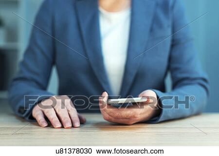 Businesswoman using smartphone View Large Photo Image Stock Image - Businesswoman using smartphone. Fotosearch