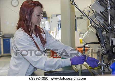 Chemist flushing tubing with distilled water. View Large Photo Image Stock Image - Chemist flushing tubing with distilled water.. Fotosearch