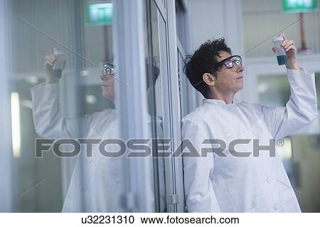 Chemist working in pharmaceutical laboratory. View Large Photo Image Stock Image - Chemist working in pharmaceutical laboratory.. Fotosearch