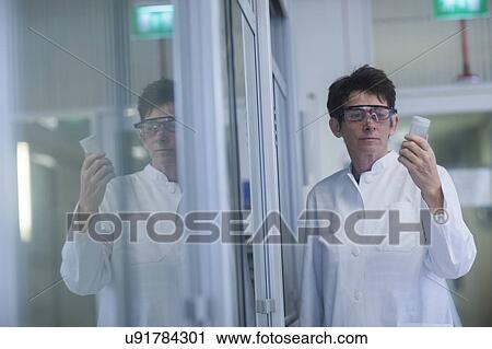 Chemist working in pharmaceutical laboratory. View Large Photo Image Stock Image - Chemist working in pharmaceutical laboratory.. Fotosearch