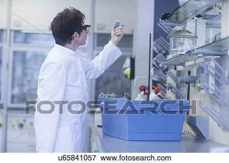 Stock Photo - Chemist working in pharmaceutical laboratory.. Fotosearch