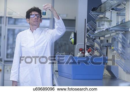 Chemist working in pharmaceutical laboratory. View Large Photo Image Stock Photograph - Chemist working in pharmaceutical laboratory.. Fotosearch